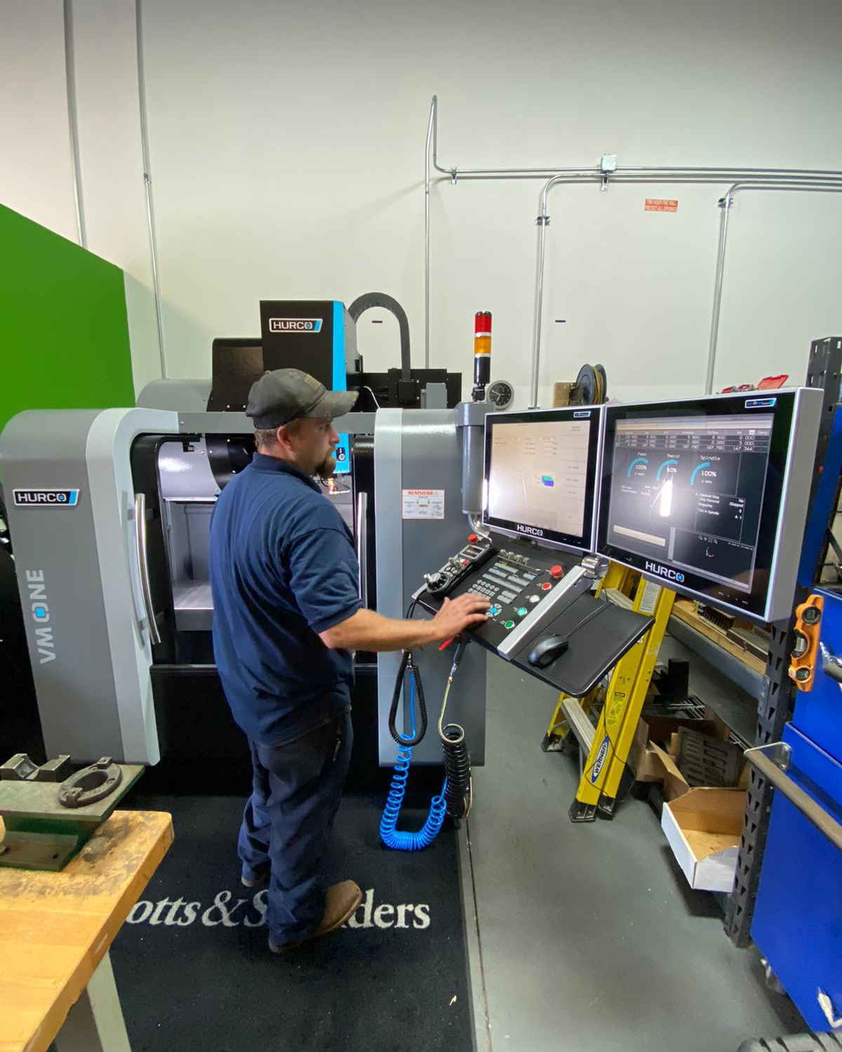 An EFS machinist running a CNC milling machine in the EFS shop in Duncan, South Carolina