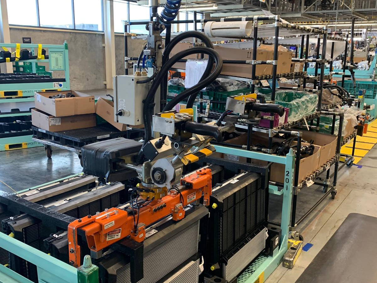 An EFS gripper handling automotive heat exchangers in returnable racks