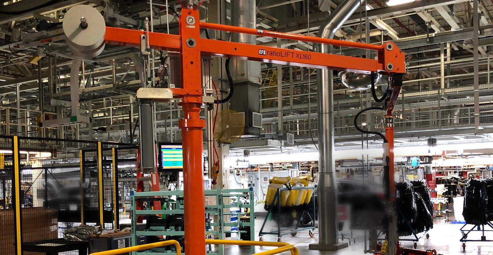 An EFS ratioLIFT XL160 manipulator on an automotive assembly line